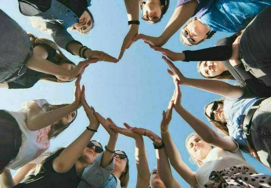 Circle of friends forming Heart